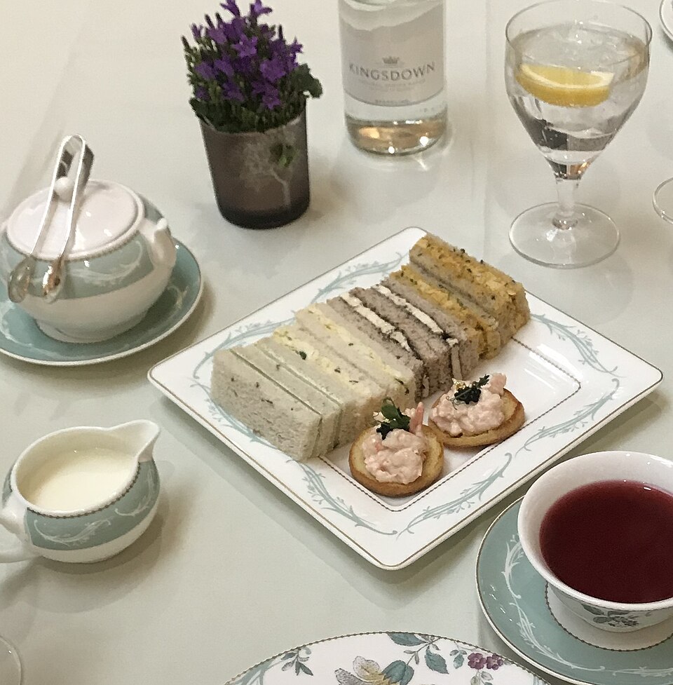 Finger sandwiches served with tea