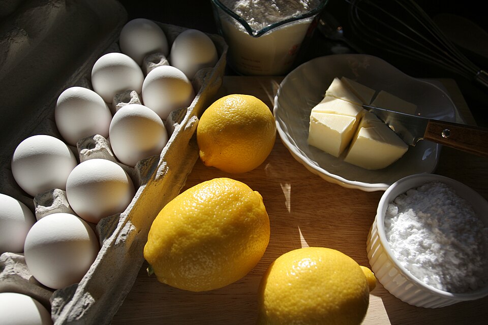 Baking ingredients: eggs, lemons, butter and sugar
