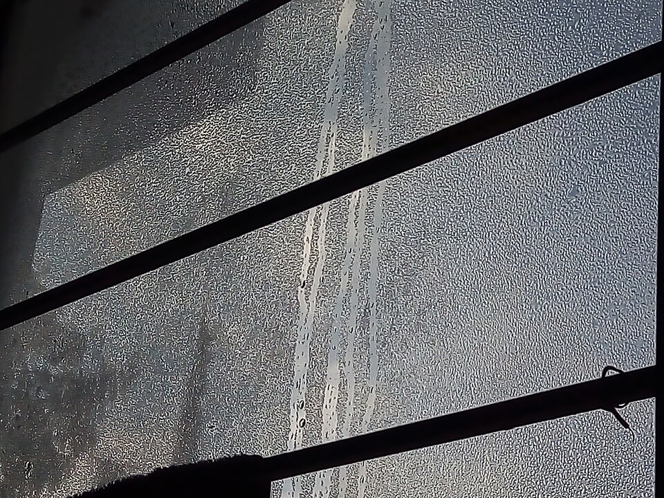 Condensation running down the inside of a window