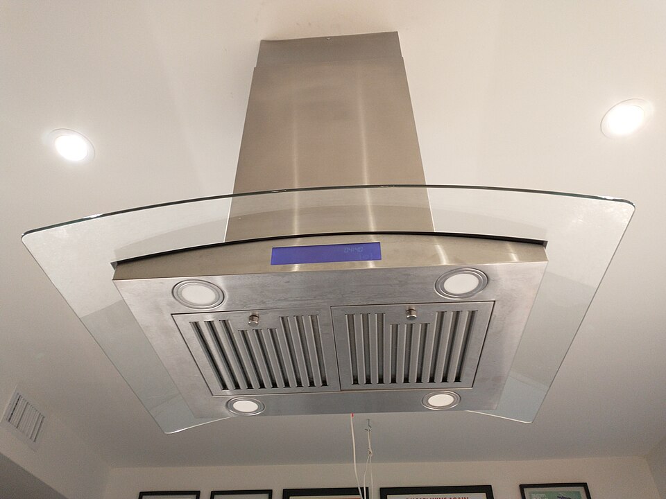 A stainless steel and glass chimney cooker hood
