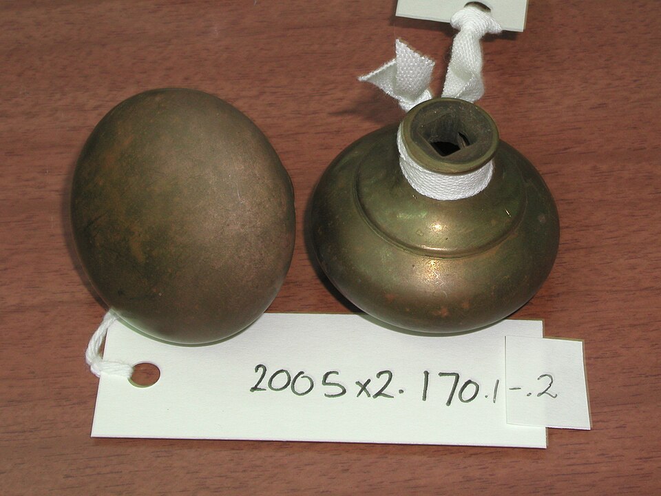 A pair of antique brass knobs