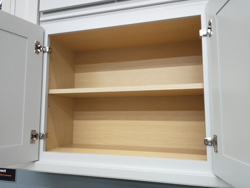 An open cabinet showing the face frame around the door opening