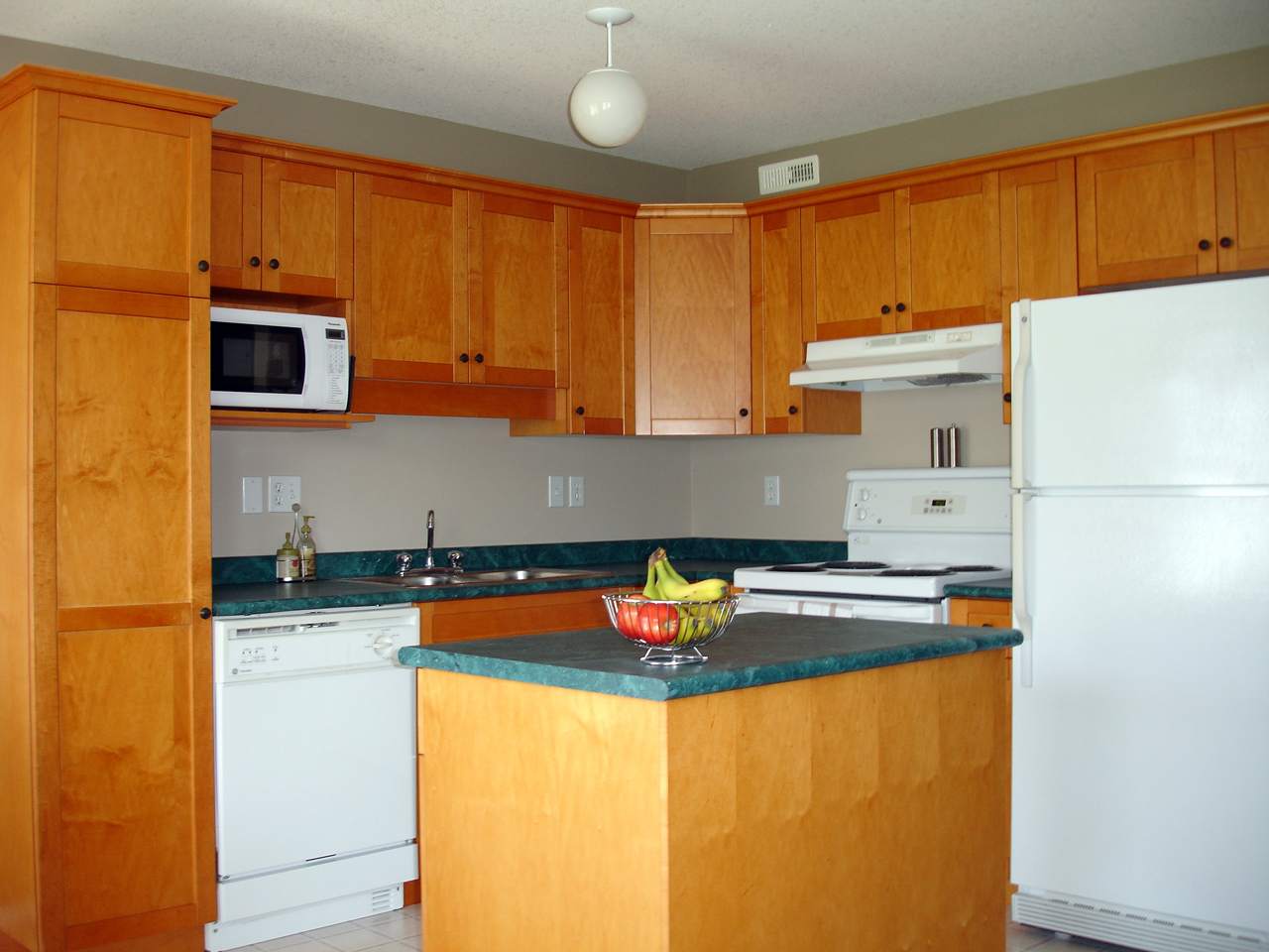 A fitted kitchen with a central island