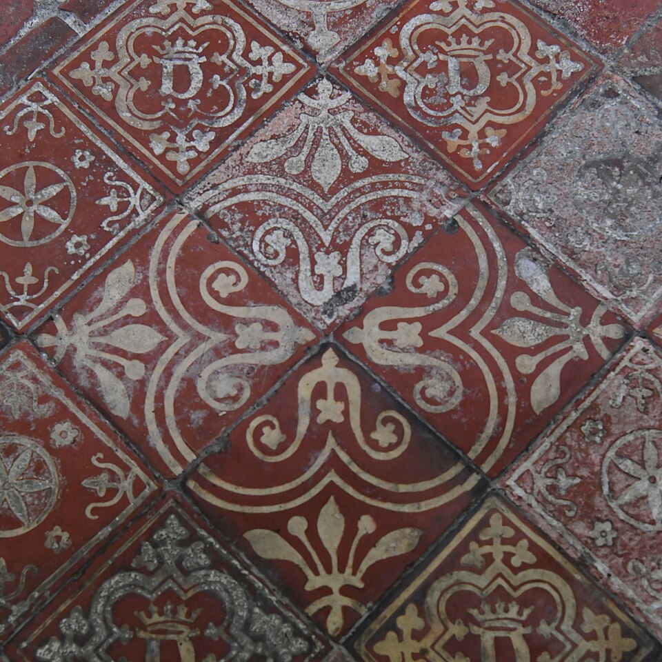 Patterned red and cream encaustic floor tiles