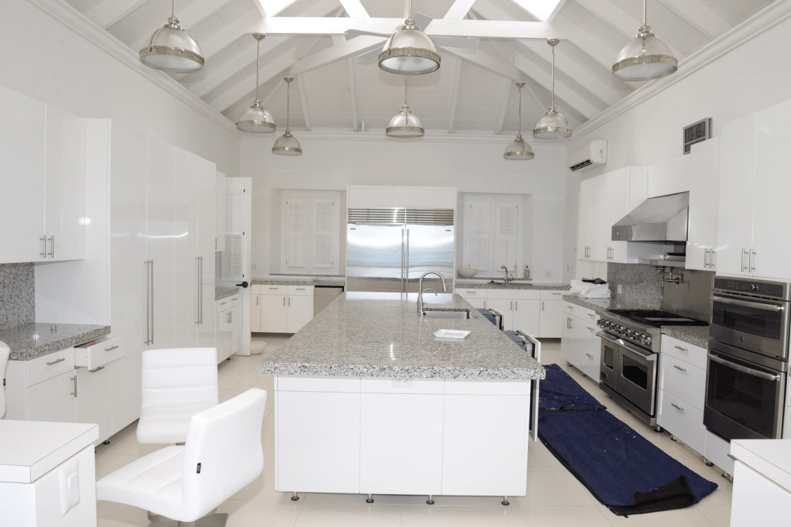Rows of pendant lights over a kitchen island