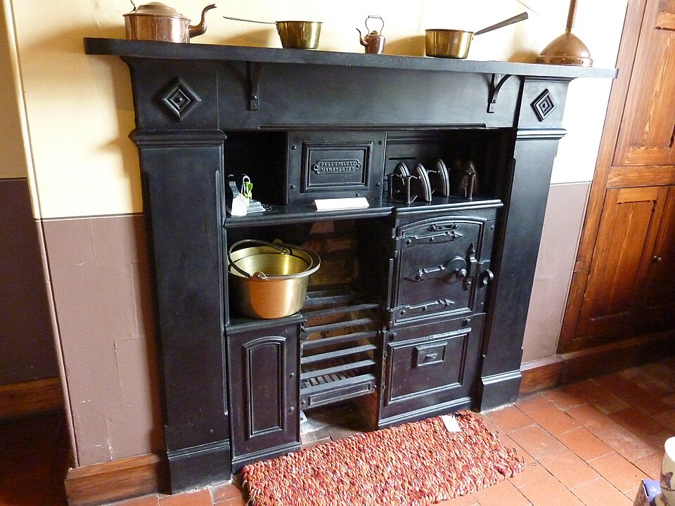 A traditional black cast-iron kitchen range