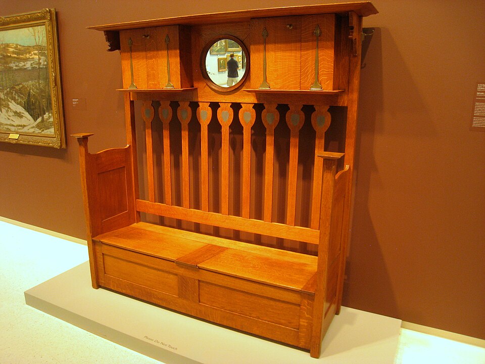 An Arts and Crafts high-backed settle by C. F. A. Voysey, around 1900
