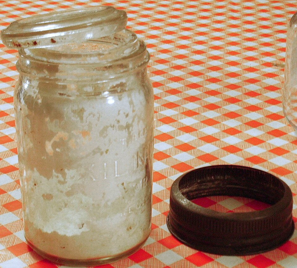 An open 1928 Kilner jar with its screw ring