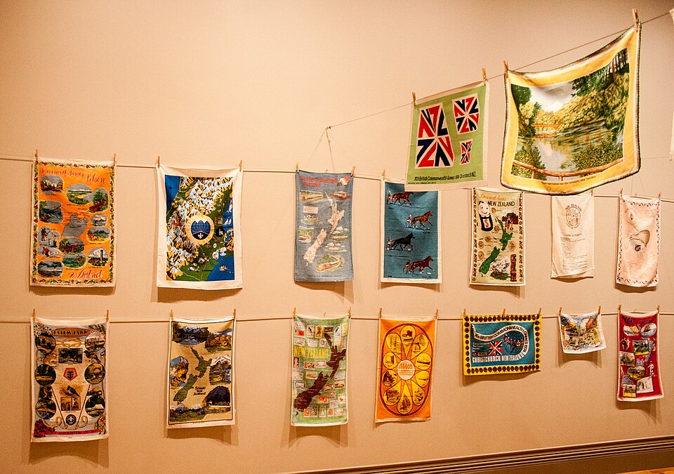 A museum display of printed souvenir tea towels