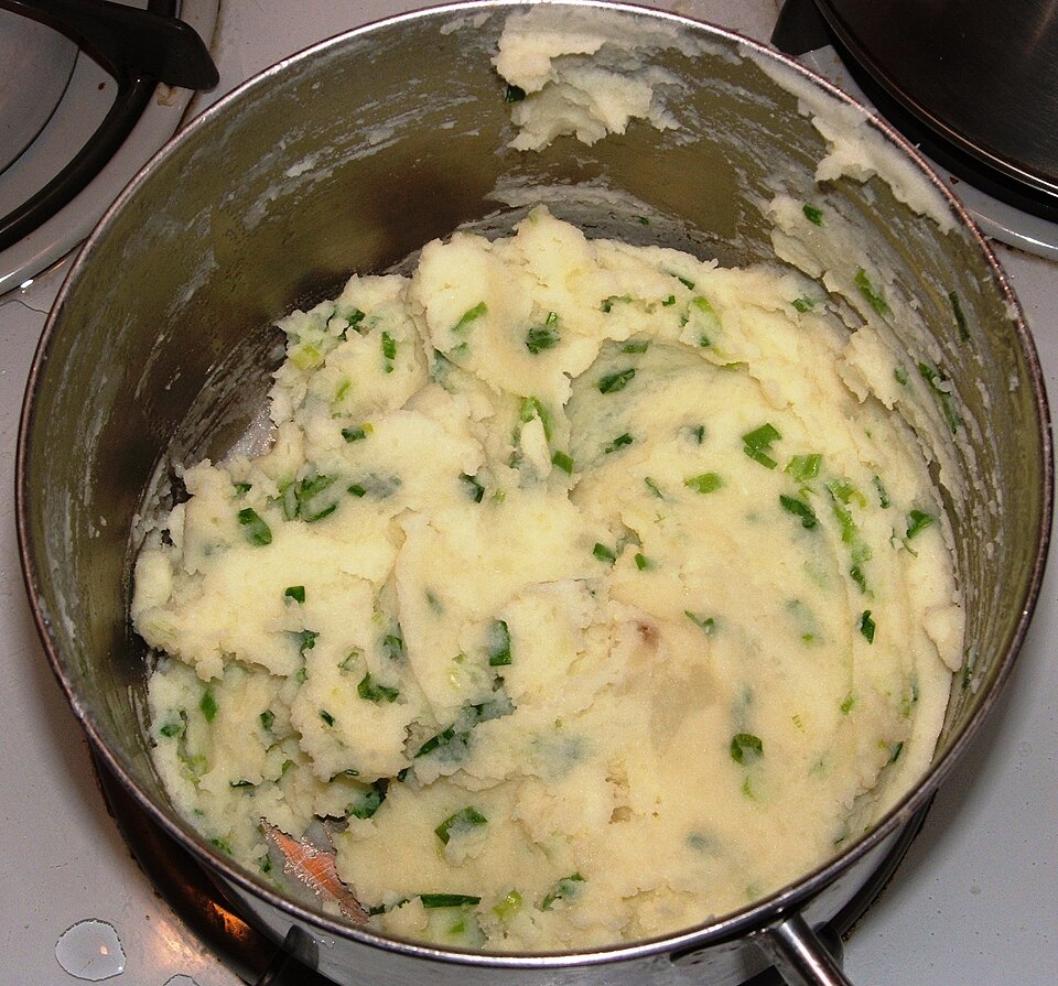 Champ: mashed potato with chopped spring onions, in a pan