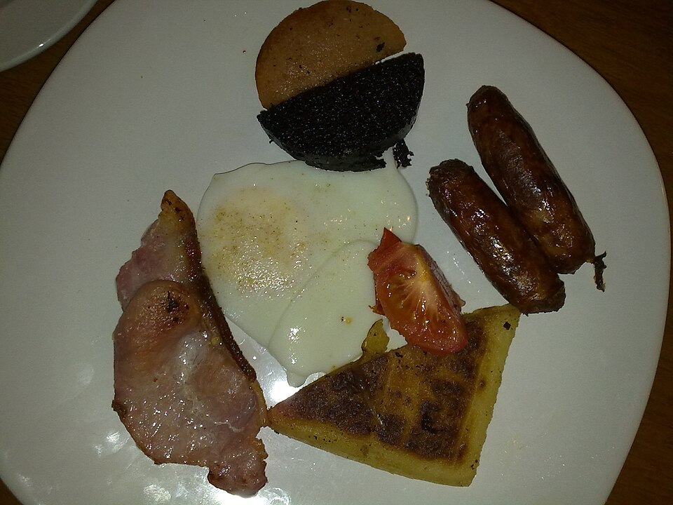 An Ulster fry with bacon, sausages, egg, black pudding and potato bread