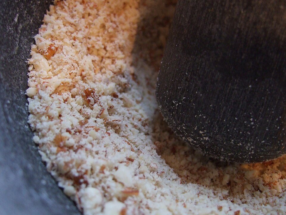 Almonds being ground to a coarse meal