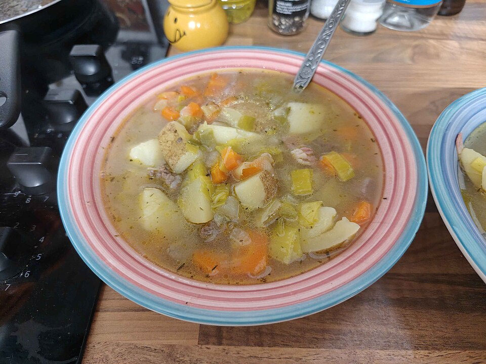 A bowl of cawl with lamb, potatoes and carrots