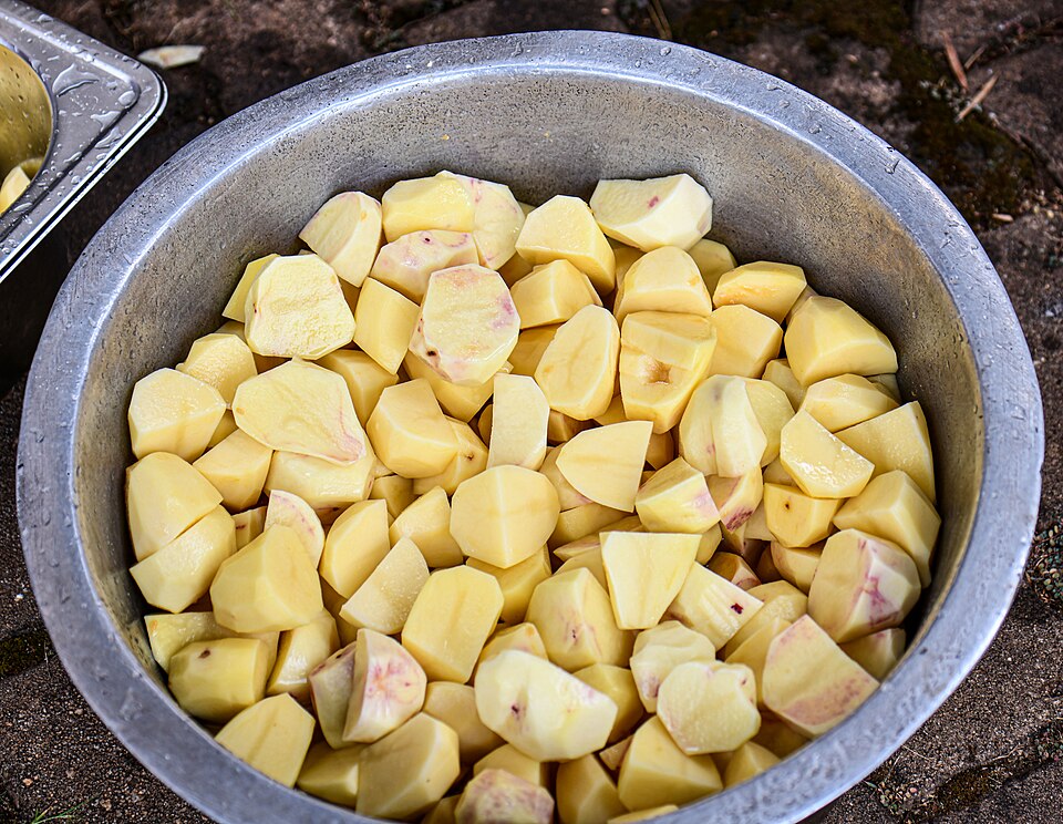 Peeled potatoes cut into chunks, ready to boil