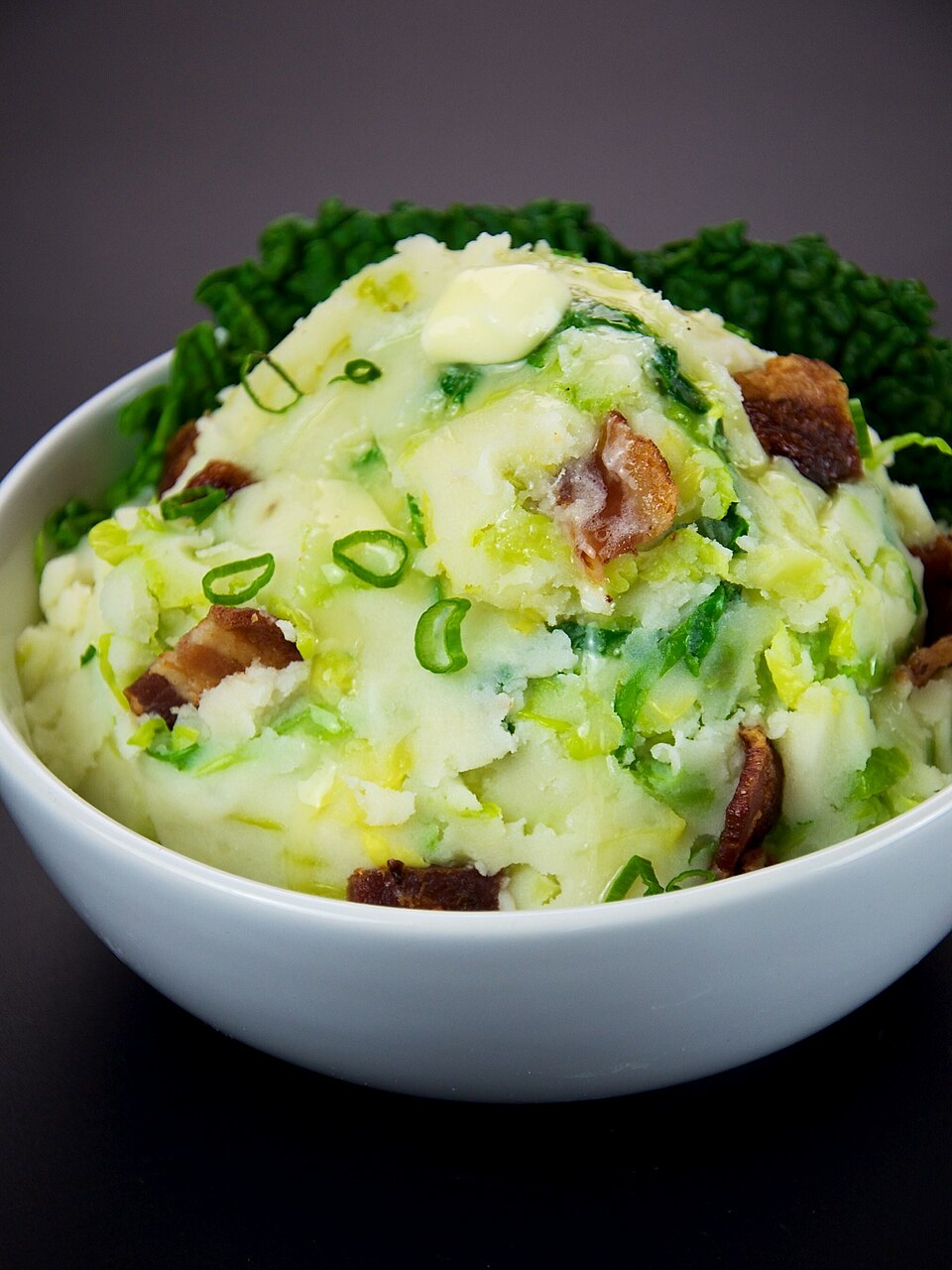 A bowl of colcannon with spring onions and kale
