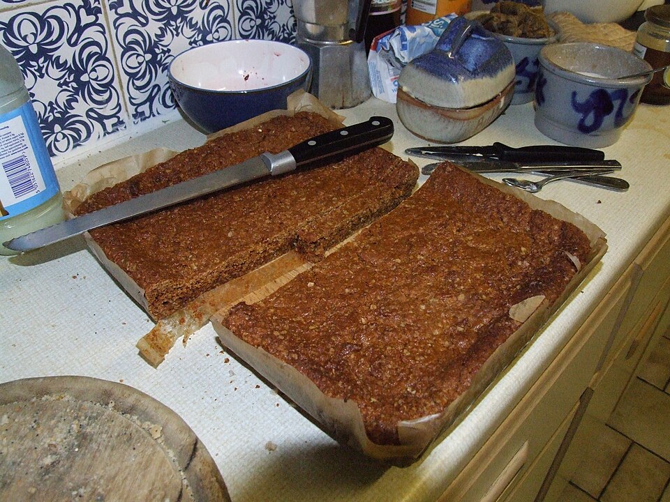 A tray of Lancashire parkin being cut into slices