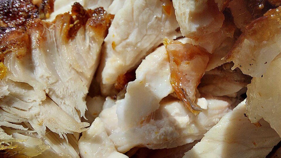 Slices of roast pork with crisp crackling