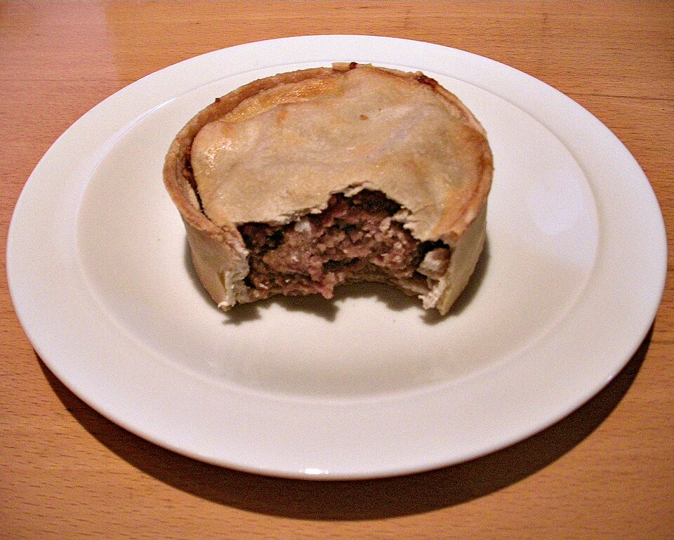 A Scotch pie cut open to show the minced meat filling