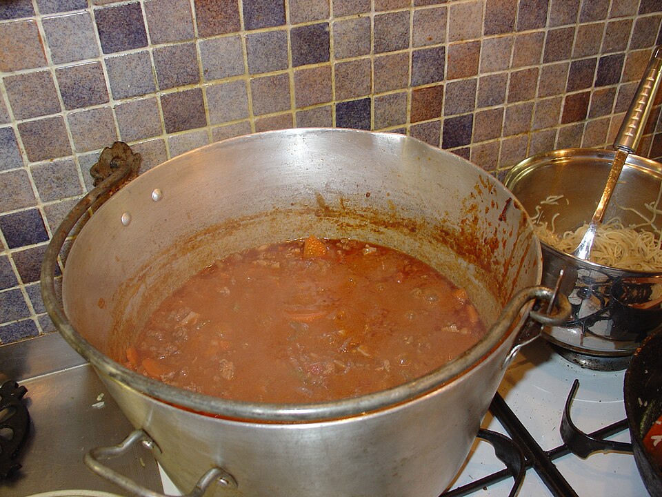A mince sauce simmering in a large pan