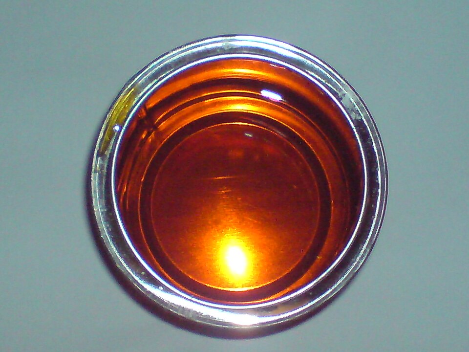 Golden syrup in a small glass dish