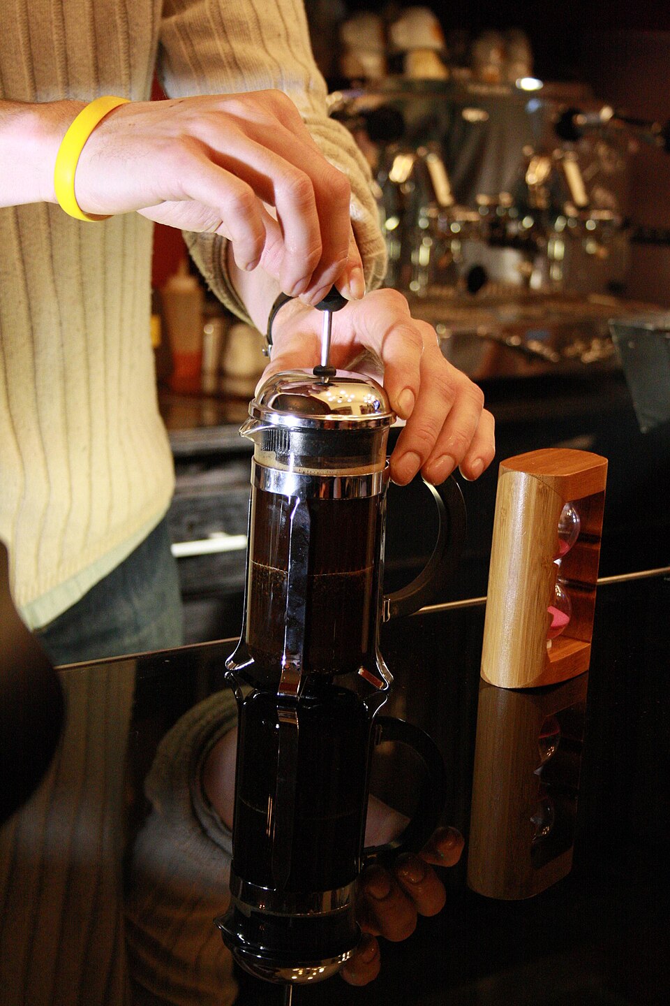 A cafetière of coffee being plunged