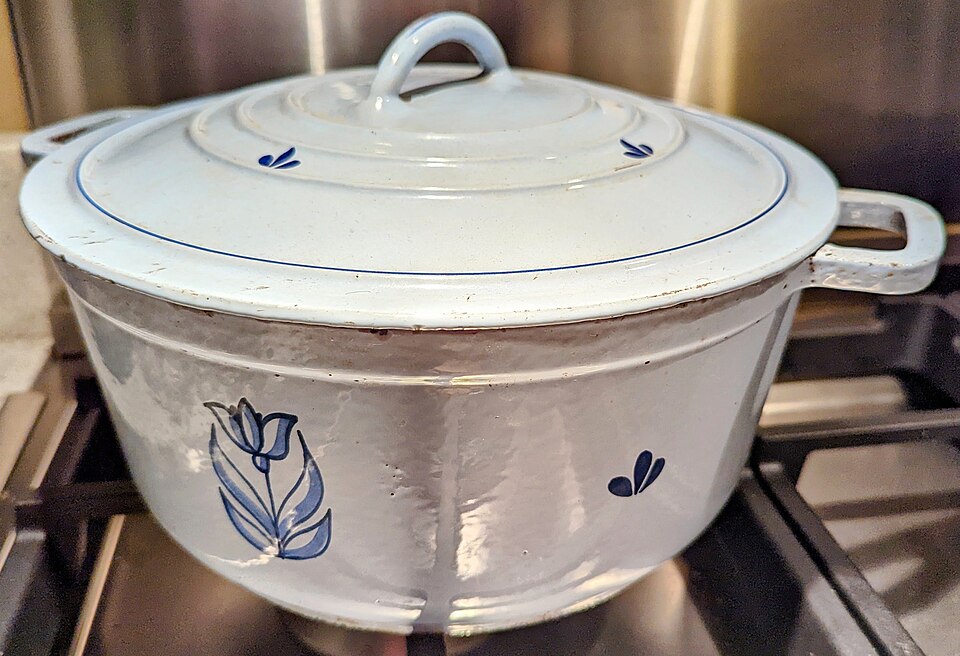 An enamelled casserole dish on a hob