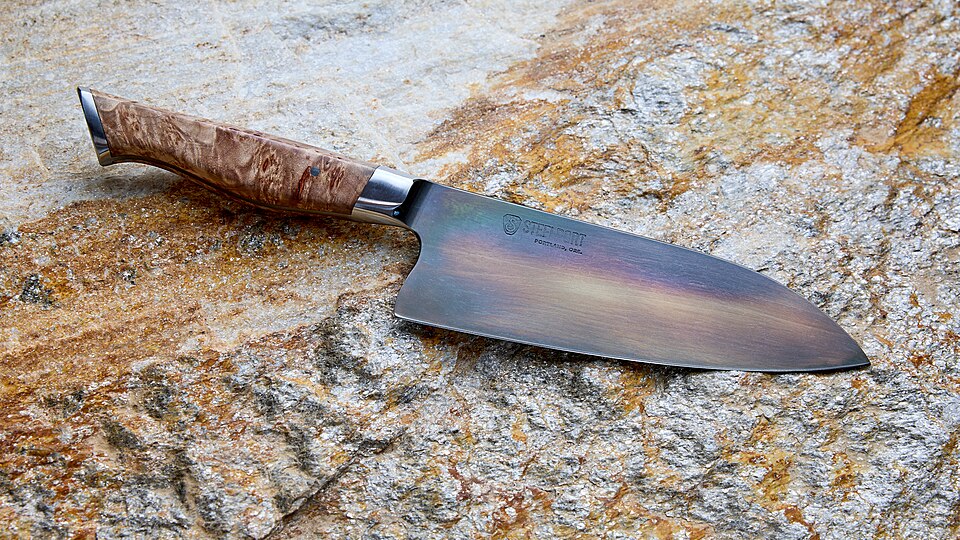 A chef's knife with a wooden handle