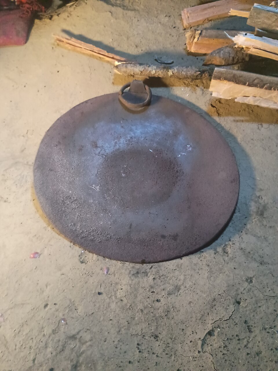 A flat round iron griddle