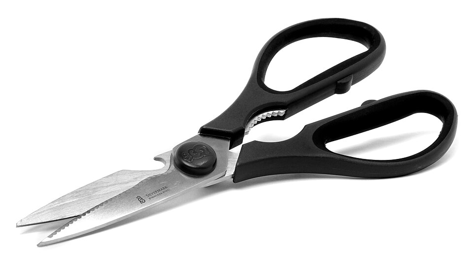 Kitchen scissors with black handles and a serrated blade