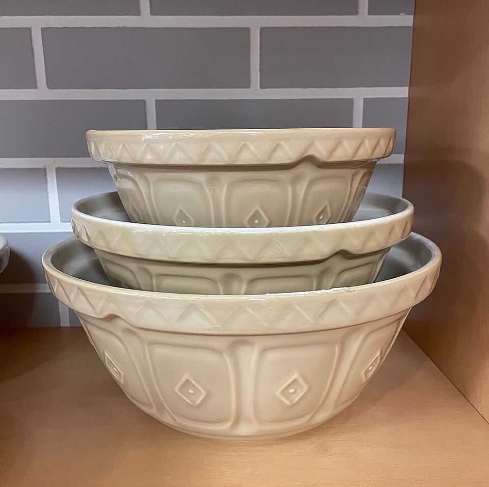Stacked cream-coloured ceramic mixing bowls