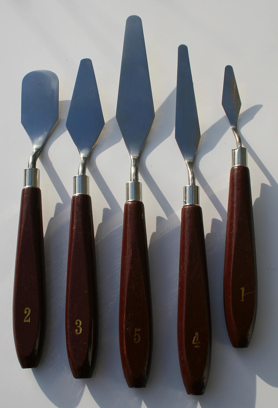 A set of small steel palette knives