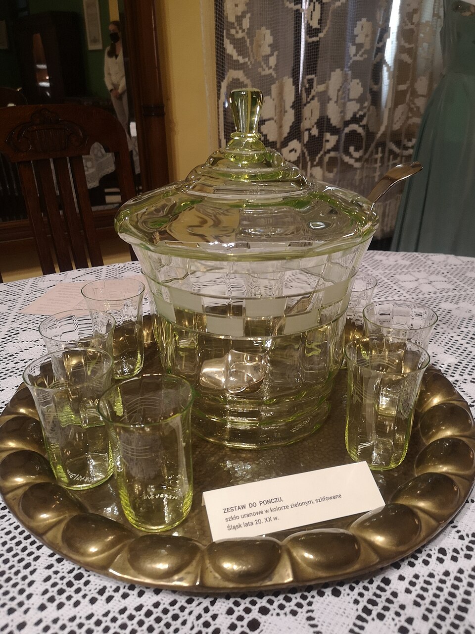 An early 20th-century glass punch bowl with matching cups