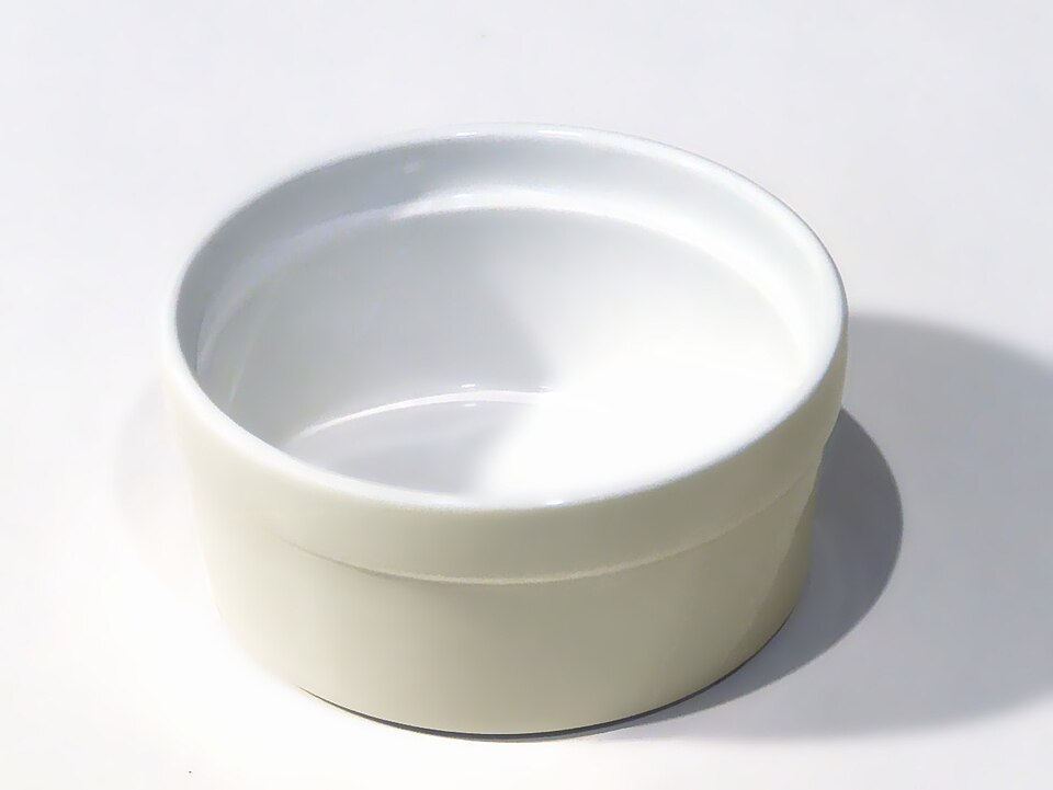 A white ribbed ramekin
