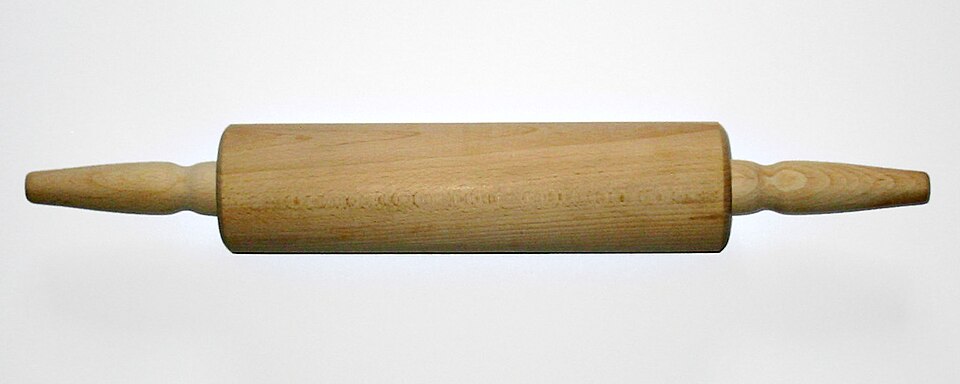A wooden rolling pin with handles
