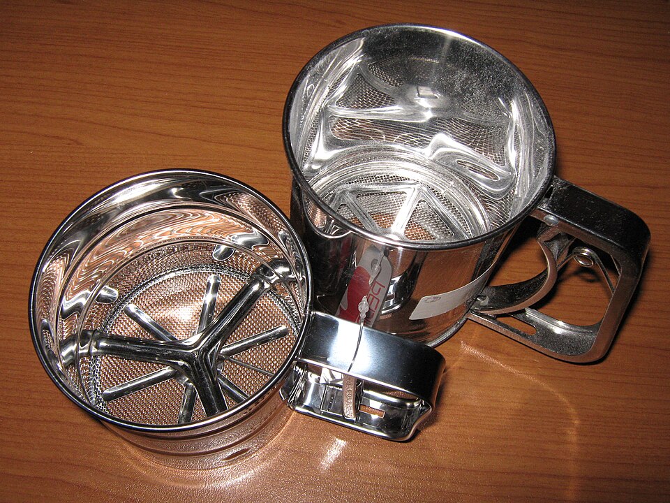 Two stainless steel flour sifters