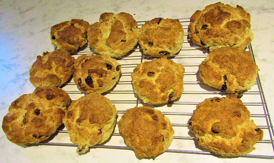 Home-baked fruit scones cooling on a wire rack
