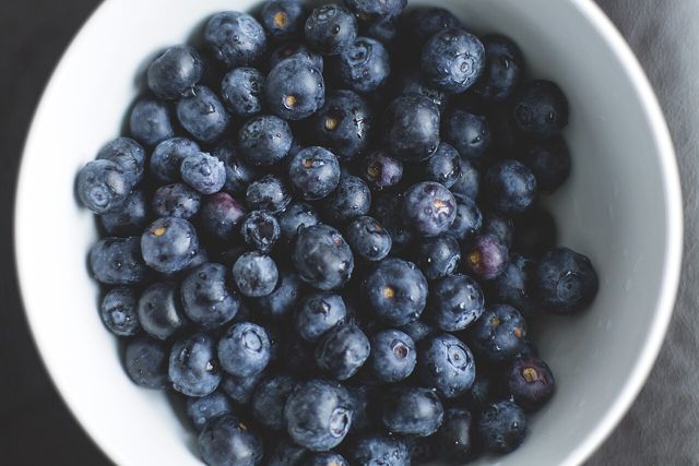 White bowl filled with blueberries