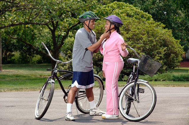 Older couple with bicycles getting ready for a ride