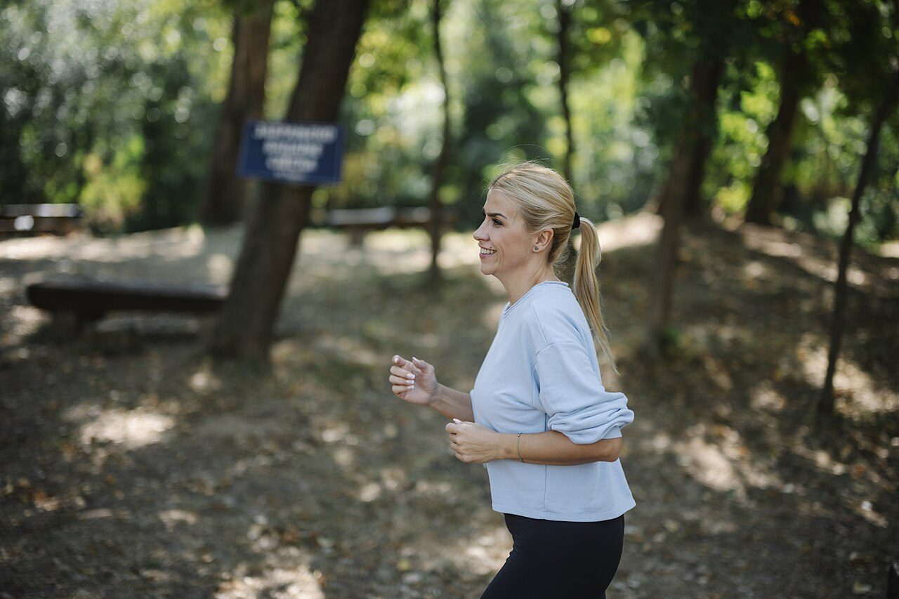Woman jogging in a park in daylight