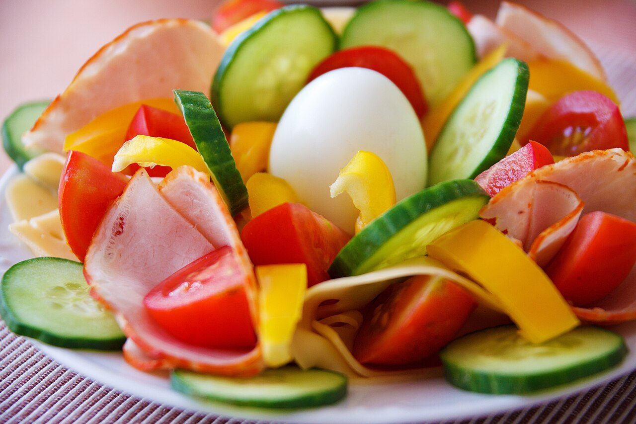 Colourful salad with egg, cucumber and tomato