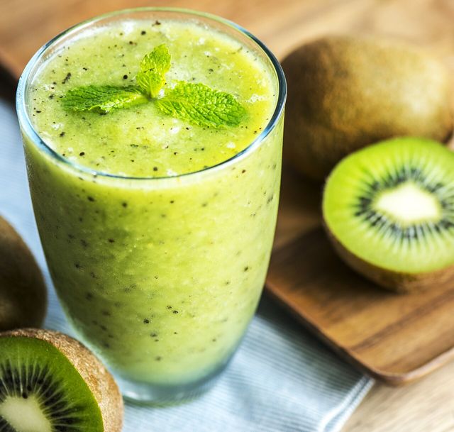 Green kiwi smoothie in a glass